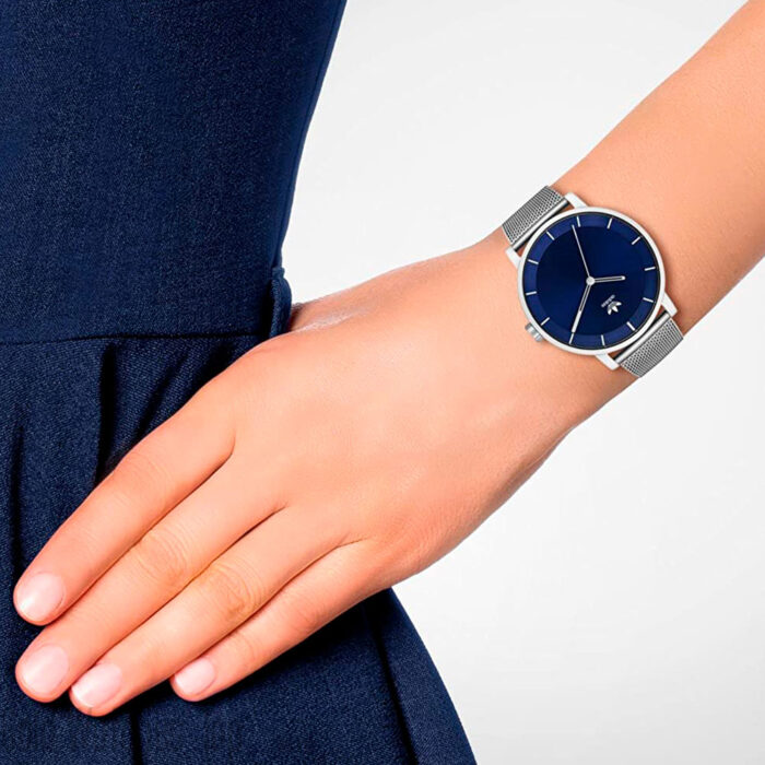 a woman using an Adidas Z04-2928-00 silver watch blue dial adidas watch