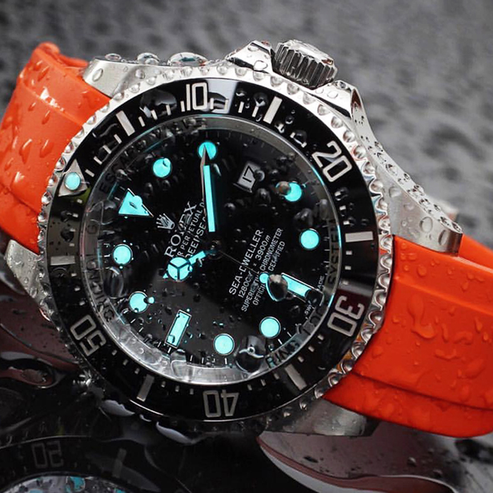 a waterproof watch with a orange silicone strap model for sale here at https://goldwatches.top/